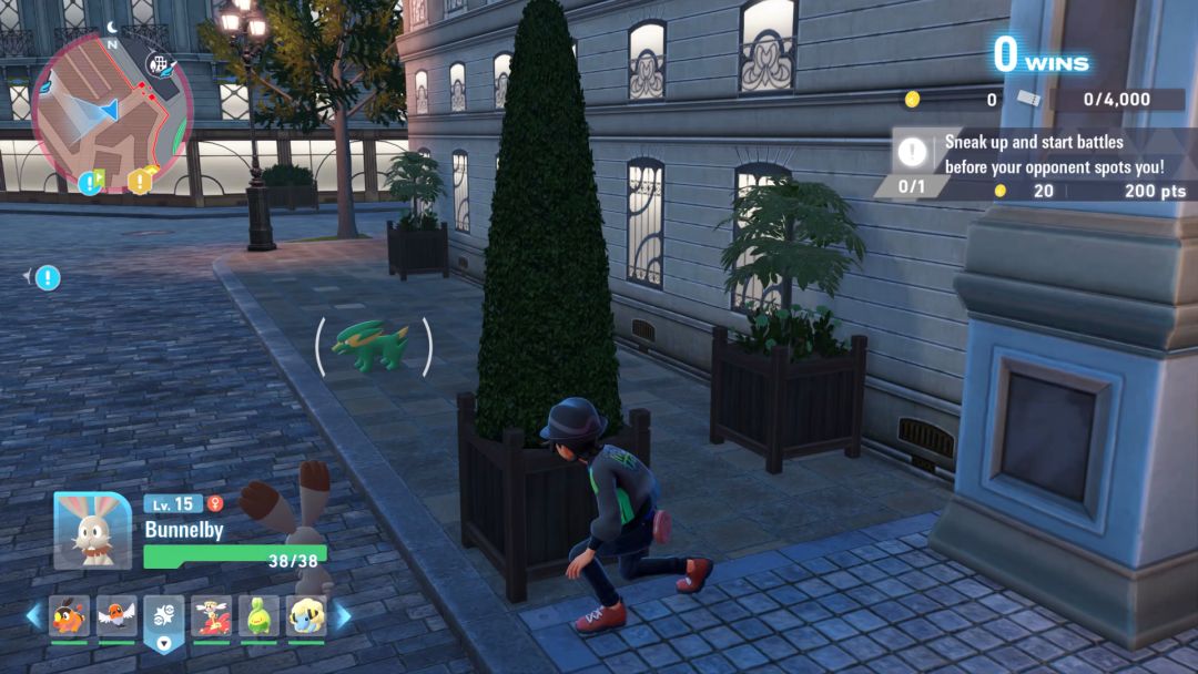 The Pokemon Trainer approaches another trainer from behind to launch a surprise attack along the rooftop.
