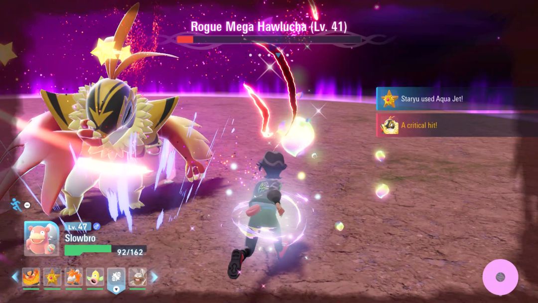 The Rogue Mega Hawlucha stumbles sideways in a daze with stars over its head as the Pokemon Trainer circles.