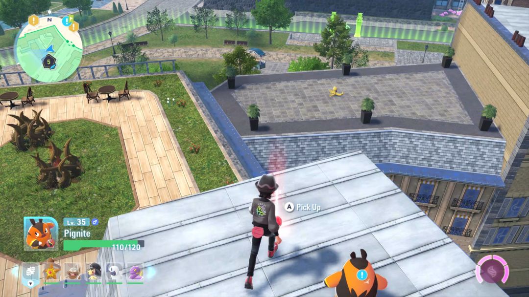 The Pokemon Trainer looks down from a rooftop at an Abra, which is sitting out in the open on a nearby roof.