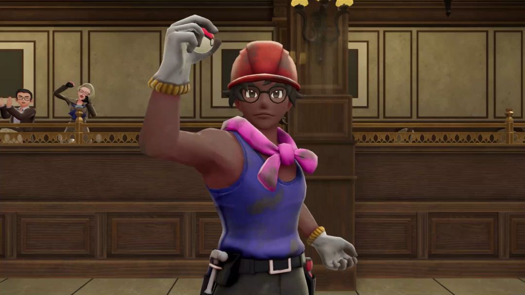 Wearing a hardhat, pink handkerchief, and a purple tank top, Thomas holds up a Poke Ball while preparing for the second course battle in Restaurant Le Yeah.