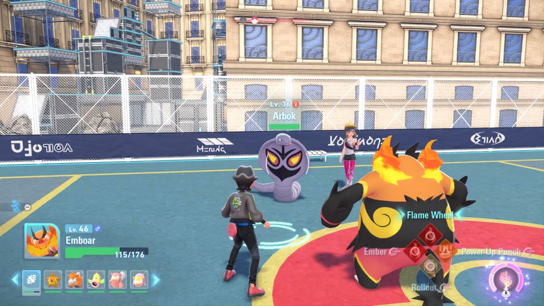 The serpentine Arbok sizes up the Pokemon Trainer's hulking Emboar as it starts forward.