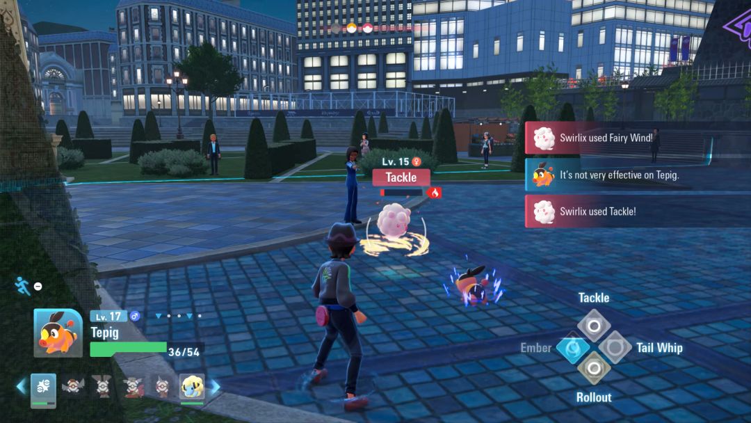 Tepig rushes Swirlix in a battle against Yvon the Office Worker in Bleu Plaza.